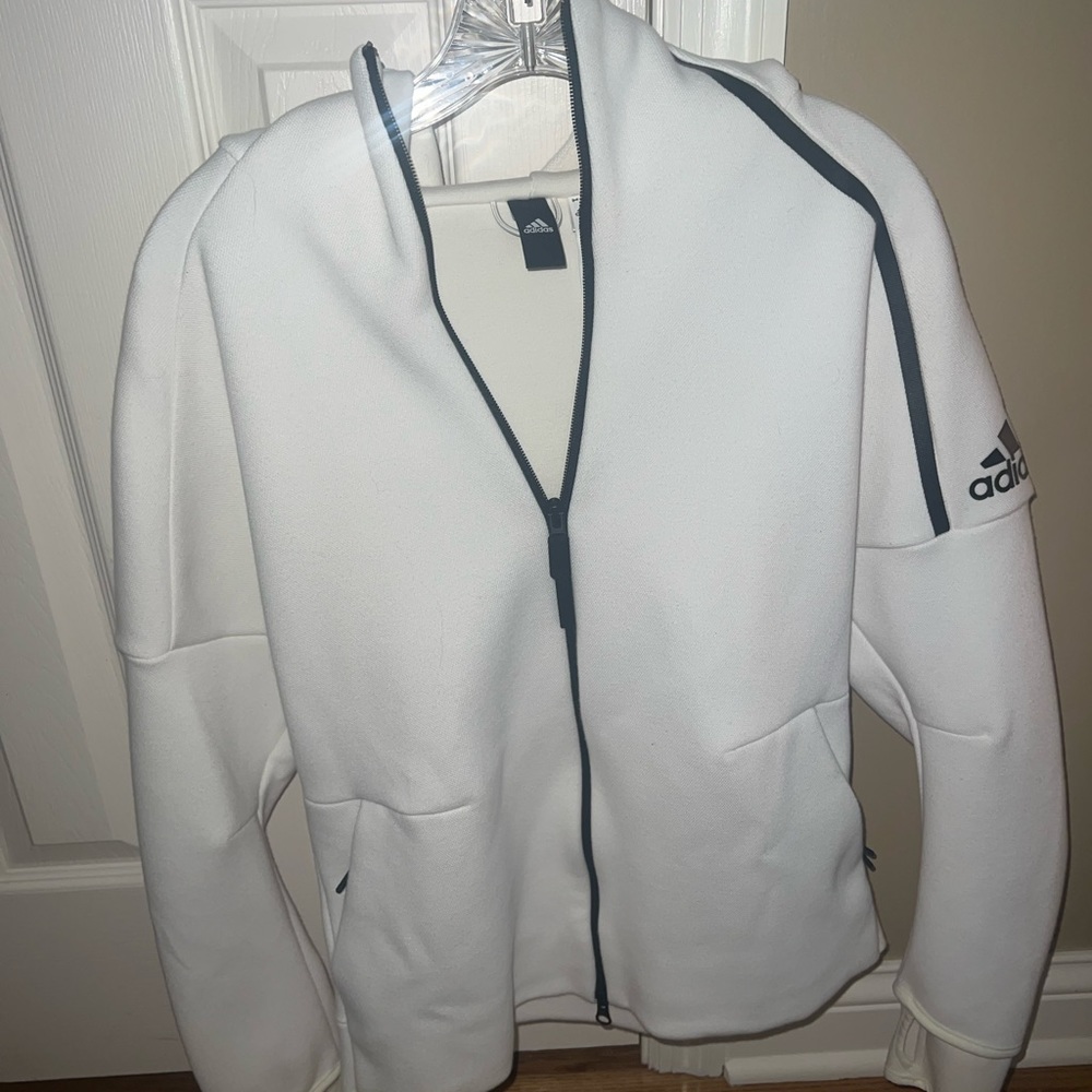 Never worn adidas jacket. Fits like a true medium. Workout or lounge jacket.